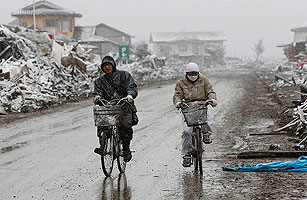 Japan Nuclear Threat Level Raised, and Exodus Continues