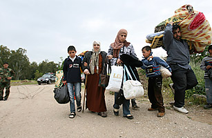 Escaping Assad: Syrians Bring Tales of Gunfire and Defiance