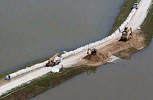 Mississippi Waters Roll into Louisiana, Bearing the Ghosts of Katrina