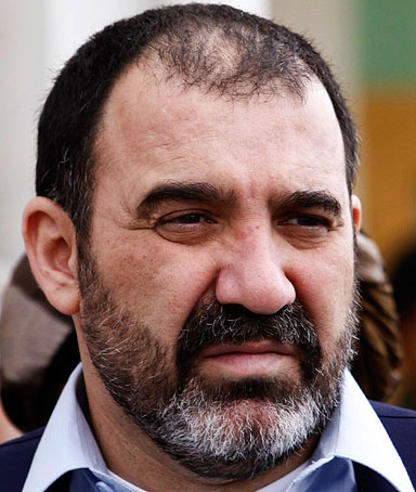 Afghan Leader Karzai Sobs Alongside Slain Brothers Body
