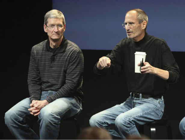 File photo shows Apple COO Cook and CEO Jobs during a news conference in Cupertino